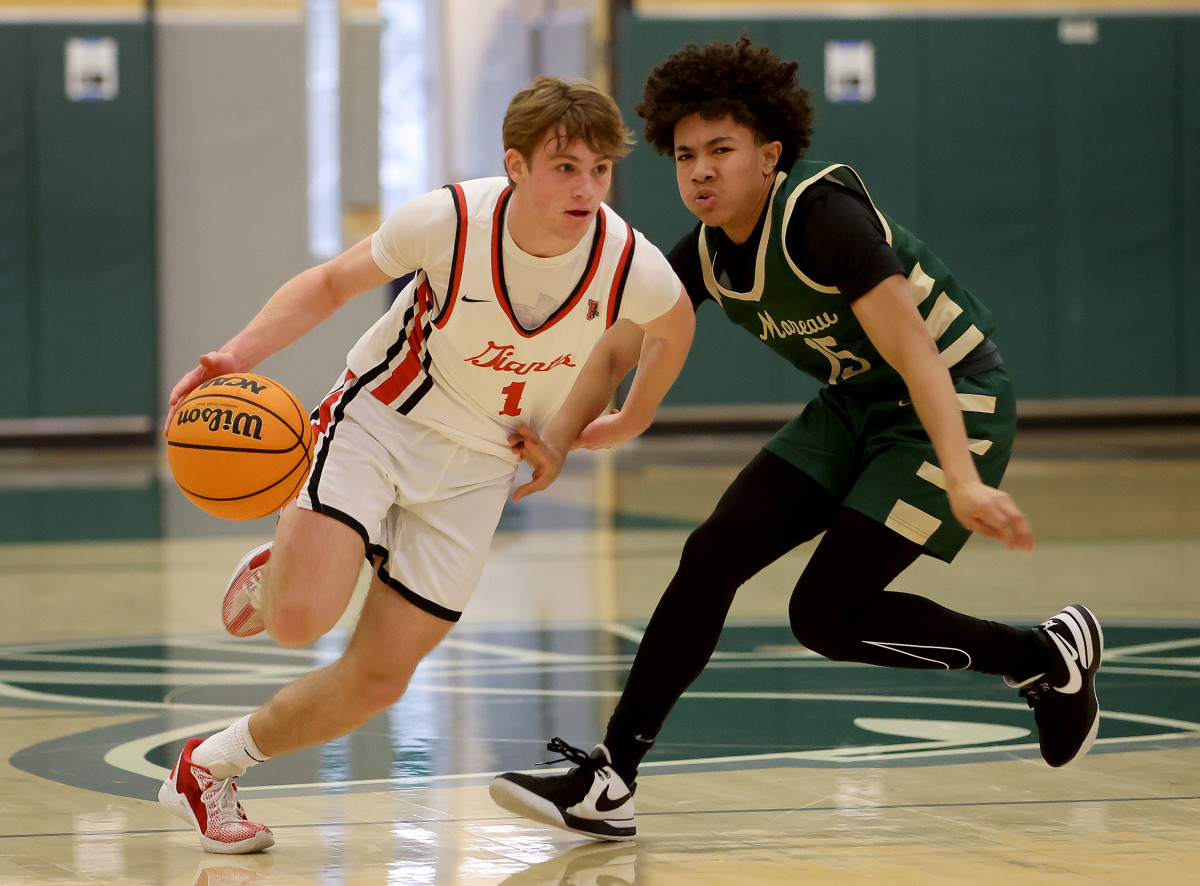 Brennan Woodley (1) had a game-high 16 points for Redwood. 
